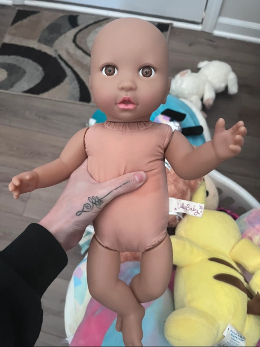LullaBaby Soft Baby Doll in Peach Bodysuit